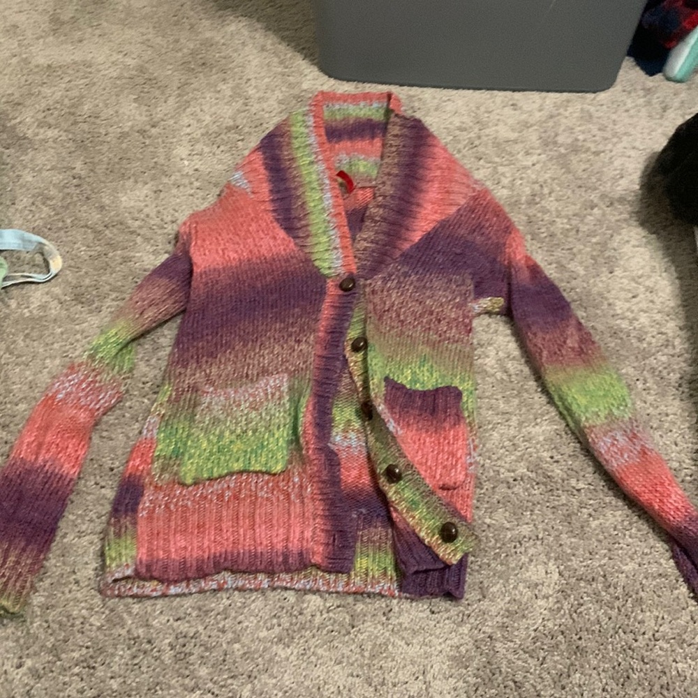 A purple green pink and yellow jacket perfect to wear anytime even as a shirt